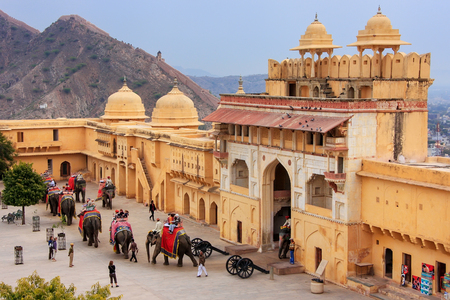 Decorated elephants entering Suraj Pol in Jaleb Chowk (main courtyard) in Amber Fort, Rajasthan, India. Elephant rides are popular tourist attraction in Amber Fort.のeditorial素材