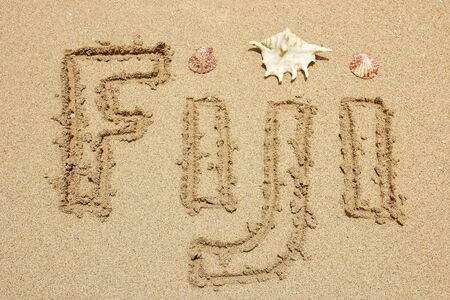 Word Fiji written on a beach - travel conceptの写真素材