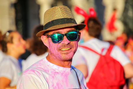 Portrait of a man taking part in The Color Run in Trieste, Italy. Trieste is the capital of the autonomous region Friuli-Venezia Giuliaのeditorial素材