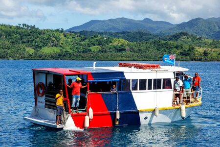 Colorful passenger boat leaving Korean Wharf on Taveuni Island, Fiji. Taveuni is the third largest island in Fiji.のeditorial素材
