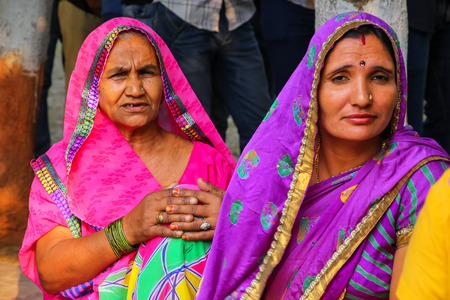 Local women sitting in the street in Taj Ganj neighborhood of Agra, Uttar Pradesh, India. Agra is one of the most populous cities in Uttar Pradeshのeditorial素材