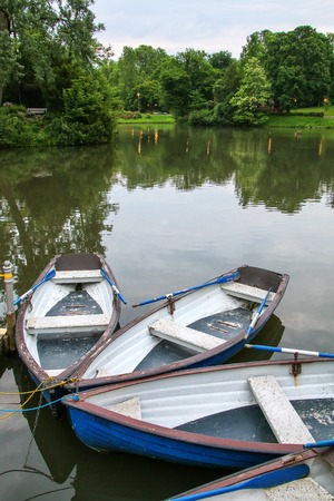 Boats by the lake shore in Kurpark, Wiesbaden, Hesse, Germany. Wiesbaden is one of the oldest spa towns in Europeの写真素材