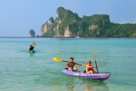 People kayaking at Ao Loh Dalum on Phi Phi Don Island, Krabi Province, Thailand. Koh Phi Phi Don is part of a marine national park.のeditorial素材