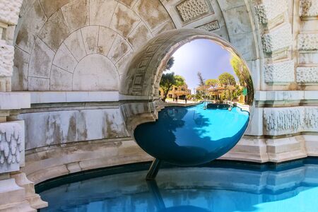 Mirror sphere and a pool in the garden near Monte Carlo Casino, Monaco.の写真素材