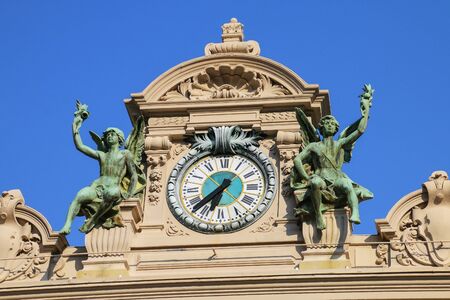 Clock above the main entrance of Monte Carlo Casino in Monaco. Monte Carlo Casino is a gambling and entertainment complex.のeditorial素材