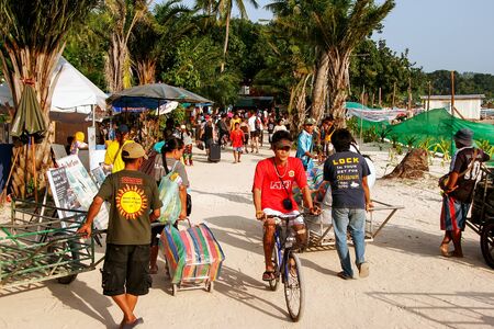 People walking in Ton Sai village on Phi Phi Don Island, Krabi Province, Thailand. Koh Phi Phi Don is part of a marine national park.のeditorial素材