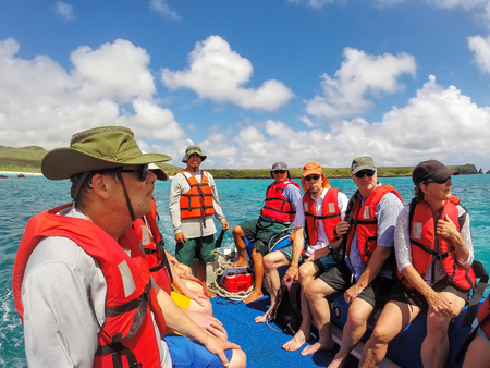 Group of tourists riding in a dinghy from Espanola Island in Galapagos National park, Ecuador.のeditorial素材