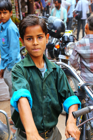 Local boy standing at the street market in Fatehpur Sikri, Uttar Pradesh, India. The city was founded in 1569 by the Mughal Emperor Akbar, and served as the capital of the Mughal Empire from 1571 to 1585のeditorial素材