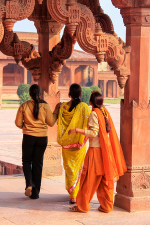 Women standing in Astrologer's kiosk in Fatehpur Sikri, Uttar Pradesh, India. Fatehpur Sikri is one of the best preserved examples of Mughal architecture in India.のeditorial素材