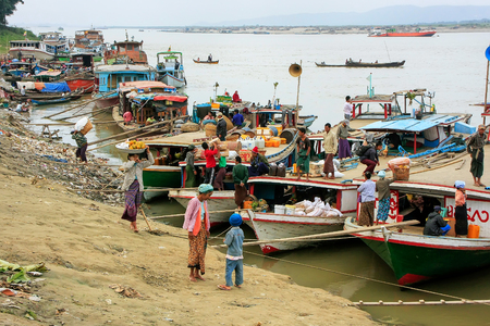 Local people driving in a truck at Ayeyarwady river port in Mandalay, Myanmar. Ayeyarwady river is the largest river in Myanmar.のeditorial素材