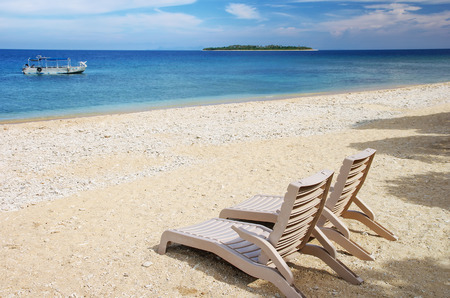 Sun chairs on white sandy beach, South Sea Island, Mamanuca group, Fiji.のeditorial素材
