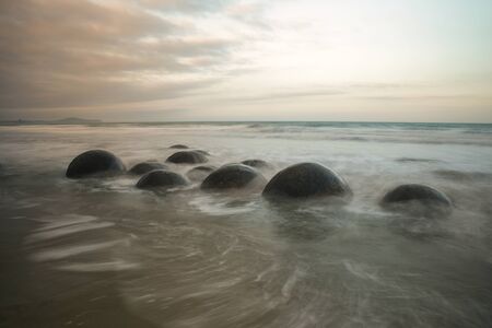 Moeraki Boulders at dusk on Koekohe Beach, Otago, South Island, New Zealand.の写真素材