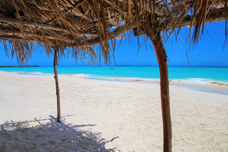 Straw hut at Fayaoue beach on the coast of Ouvea lagoon, Mouli and Ouvea Islands, Loyalty Islands, New Caledonia.の写真素材