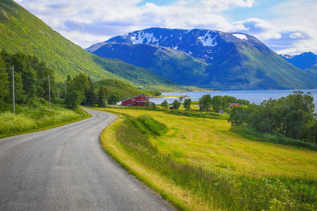 View of Highway 83 along Gullesfjord on Hinnoya Island, Vesteralen archipelago, Northern Norway....