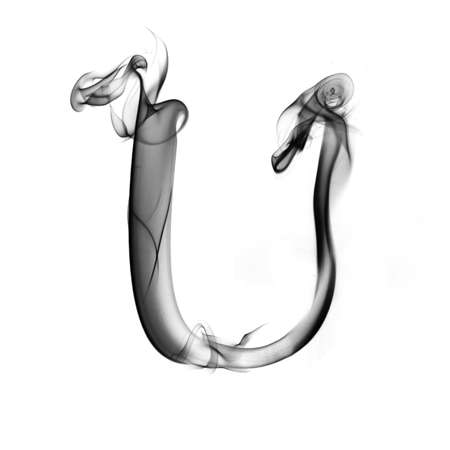 one letter from a smoky alphabet isolated on white backgroundの写真素材