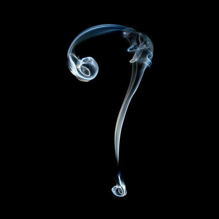 one sign from a smoky alphabet isolated on black backgroundの写真素材