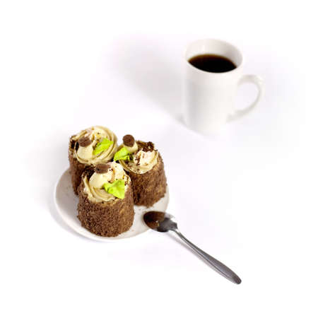 closeup photo of three tasty cakes on a dish with a cup of coffee not isolatedの写真素材