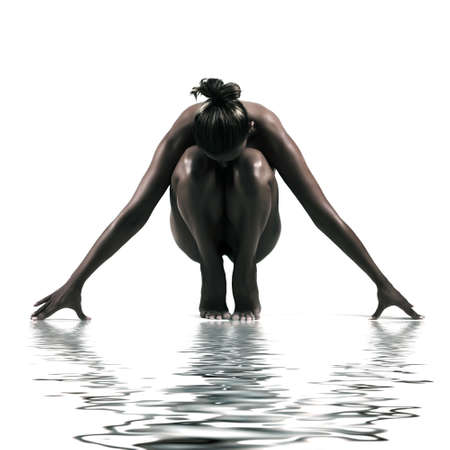 artistic nude studio shoot of woman on white background with water reflectionの写真素材