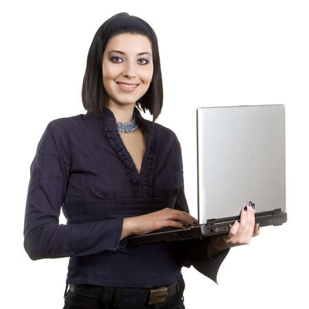 Portrait of a beautiful business woman holding laptop. Isolated on white background
の写真素材