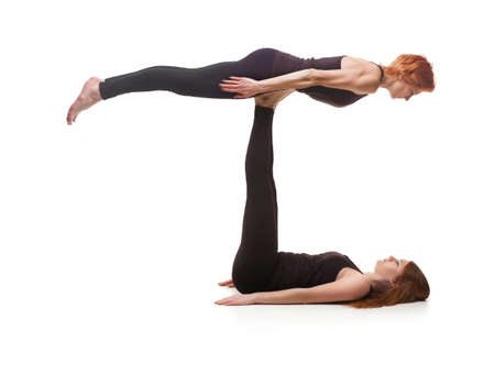 paired yoga on a white backgroundの写真素材