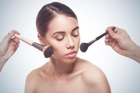 Portrait of the woman making make-upの写真素材
