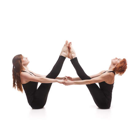 paired yoga on a white backgroundの写真素材