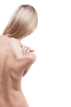 Woman with backache from behind, naked body の写真素材
