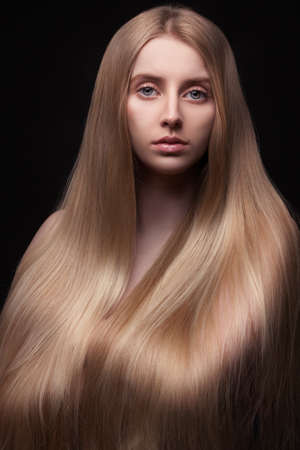 Photo of young beautiful woman with long hairの写真素材