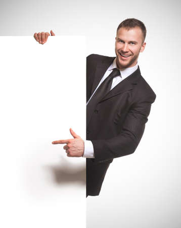 businessman holding blank billboardの写真素材