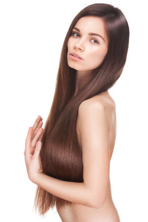 beautiful young brunette woman with long straight  hair posing isolated on white background  Beauty face with closed eyesの写真素材