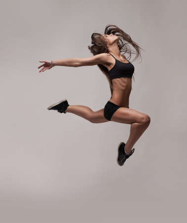 caucasian fitness woman jumpingの写真素材