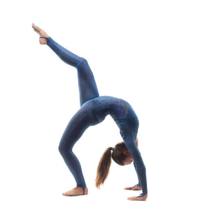 Woman doing stretching exercises on white backgroundの写真素材