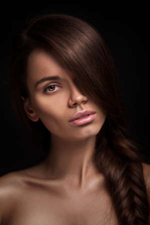 Beautiful Woman with Straight Long Hair on black backgroundの写真素材