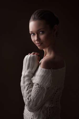 Fashion photo of beauty woman on dark backgroundの写真素材
