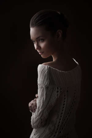 Fashion photo of beauty woman on dark backgroundの写真素材