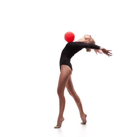 studio shoot of cute woman gymnast isolated over white studio backgroundの写真素材