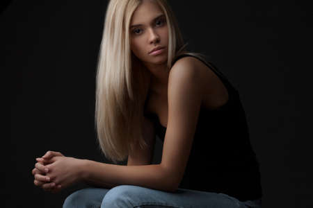 Portrait of beautiful sexy women posing on dark backgroundの写真素材