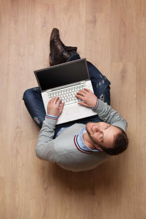 top view portrait of young man with laptop