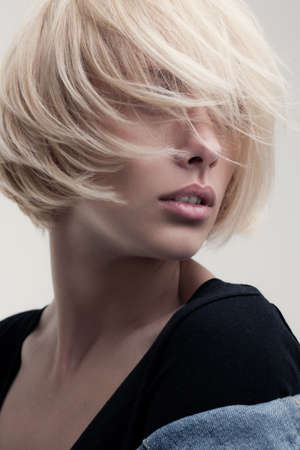 closeup fashion portrait of blonde beauty on white backroundの写真素材