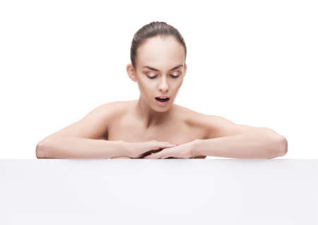 surprised beautiful young woman with clean fresh skin and copyspaseの写真素材