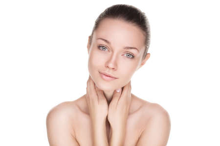 closeup portrait of beauty woman with clean fresh skin isolated over whiteの写真素材