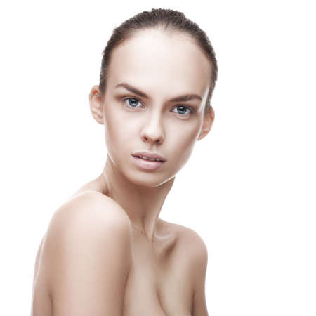 closeup portrait of beauty woman with clean fresh skin isolated over whiteの写真素材