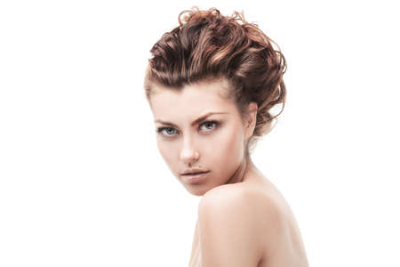 studio shot of beautiful woman with curly hair isolated over whiteの写真素材