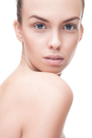 closeup portrait of beauty woman with clean fresh skin isolated over whiteの写真素材