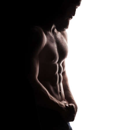 closeup of strong athletic man isolated on white backgroundの写真素材