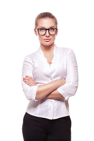 studio portrait of successful business woman in glasses with arms crossed.  isolated over white backgroundの写真素材