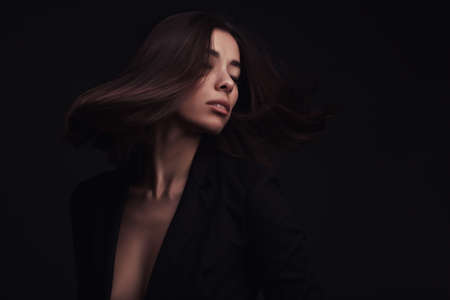 Portrait of a beautiful girl with flying hair