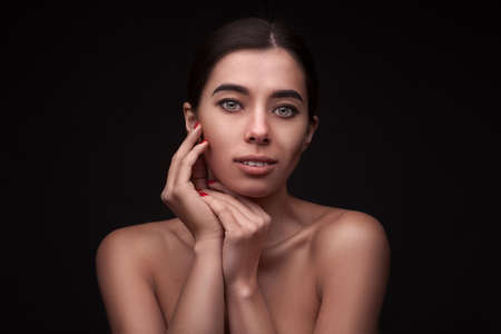 beautiful woman over dark backgroundの写真素材