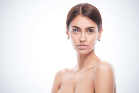 closeup portrait of young adult woman with clean fresh skinの写真素材