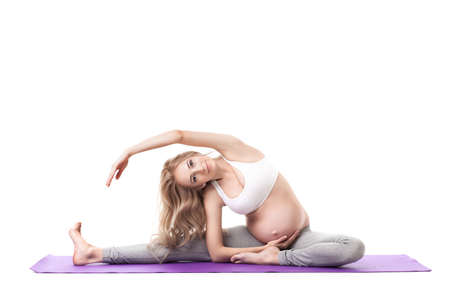 Portrait Of Pregnant Woman Doing Yogaの写真素材